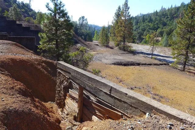 an aerial view of a house with outdoor seating
