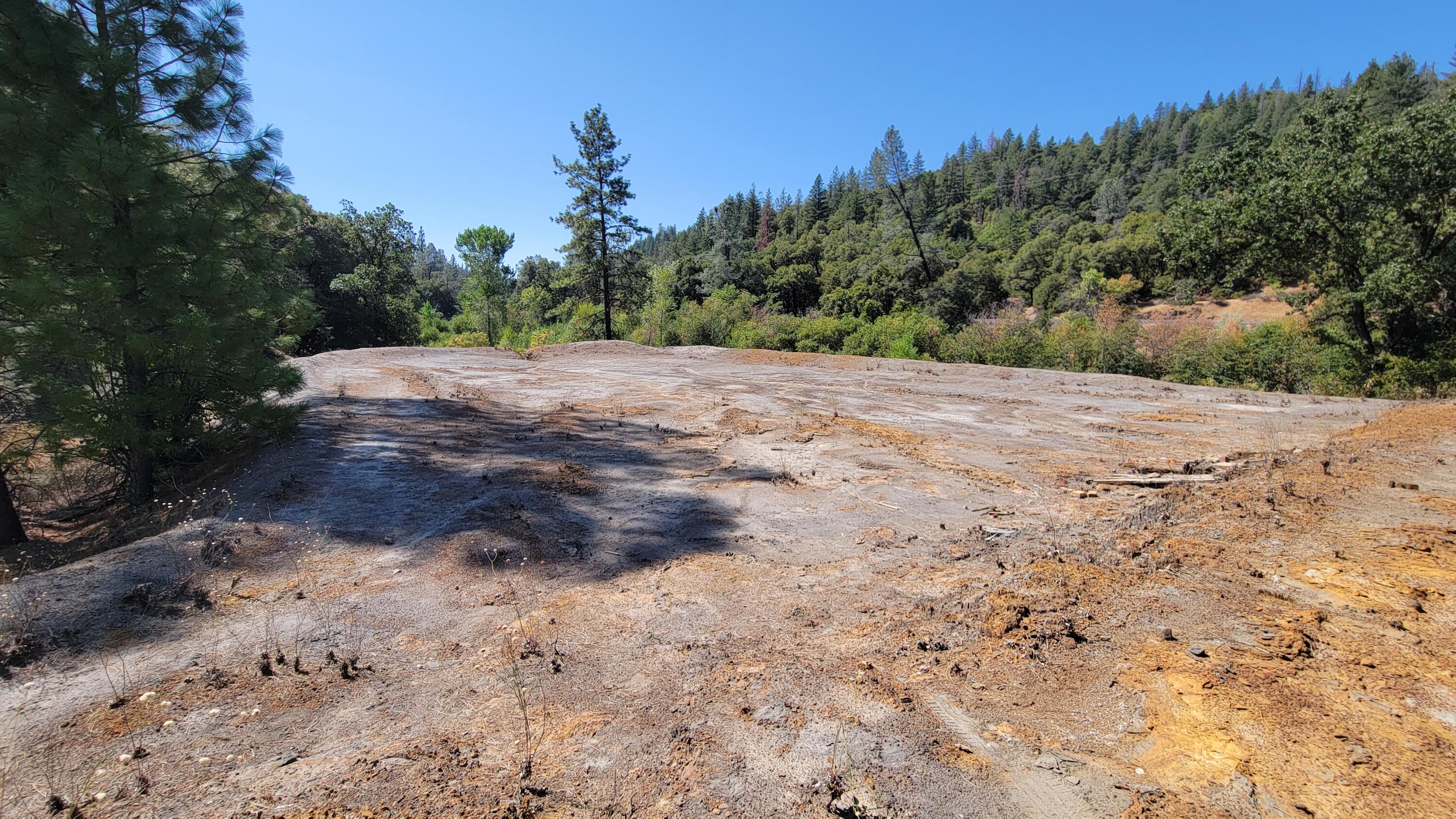 Ca-299 Oak Run, CA 96069 - Photo 5 of 34 a view of dirt road with a building in the background