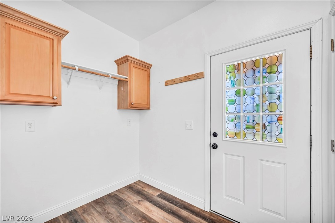 225 California Street Searchlight, NV 89046 - Photo 30 of 64 Functional mudroom featuring a charming stained-glass door and convenient wall-mounted storage.