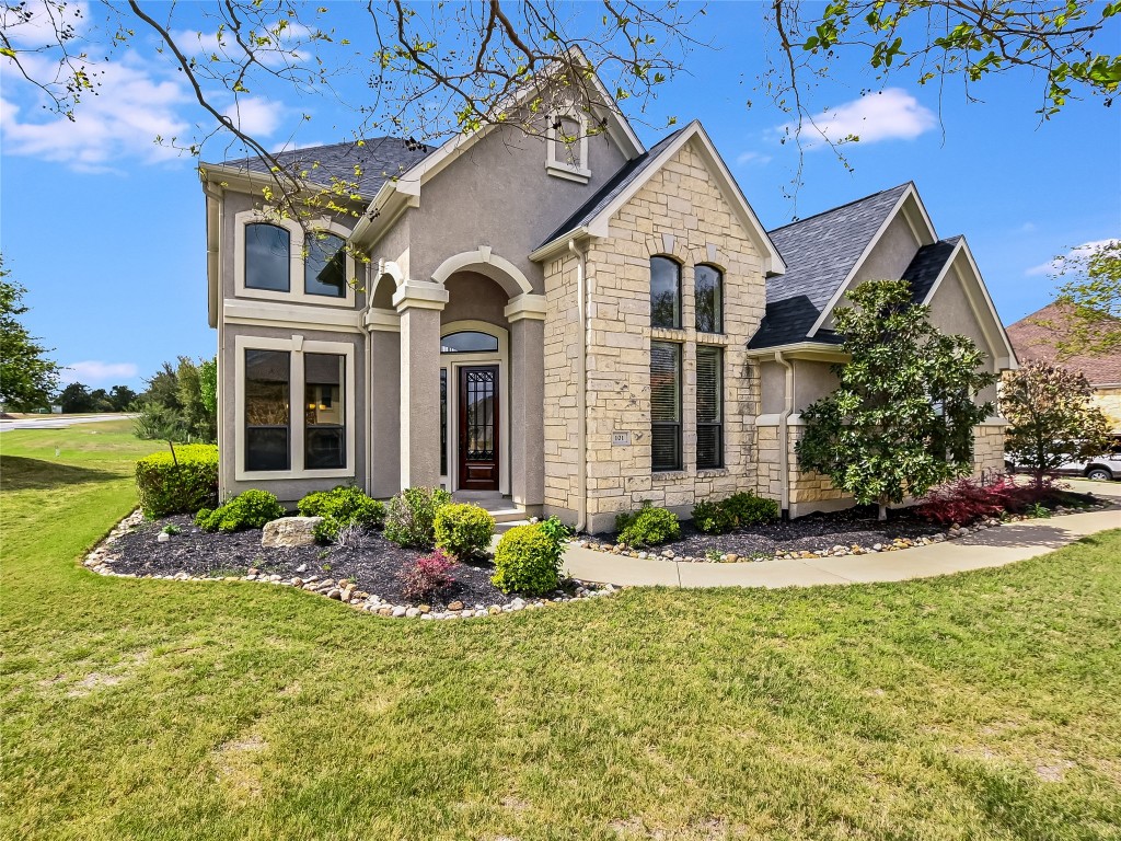 front view of a house with a yard