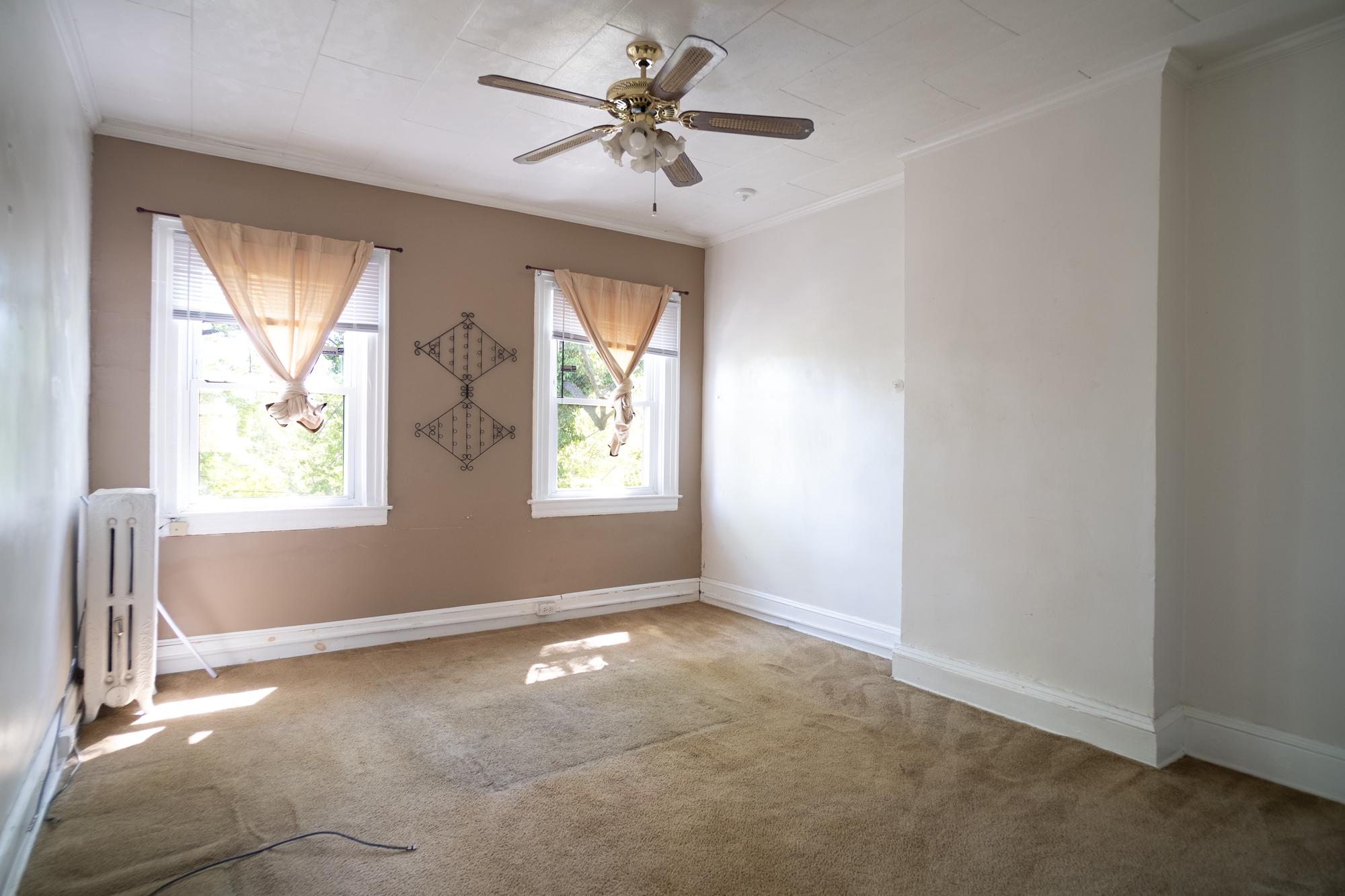 413 Rosecroft Terrace Baltimore, MD 21229 - Photo 11 of 21 an empty room with windows and fan