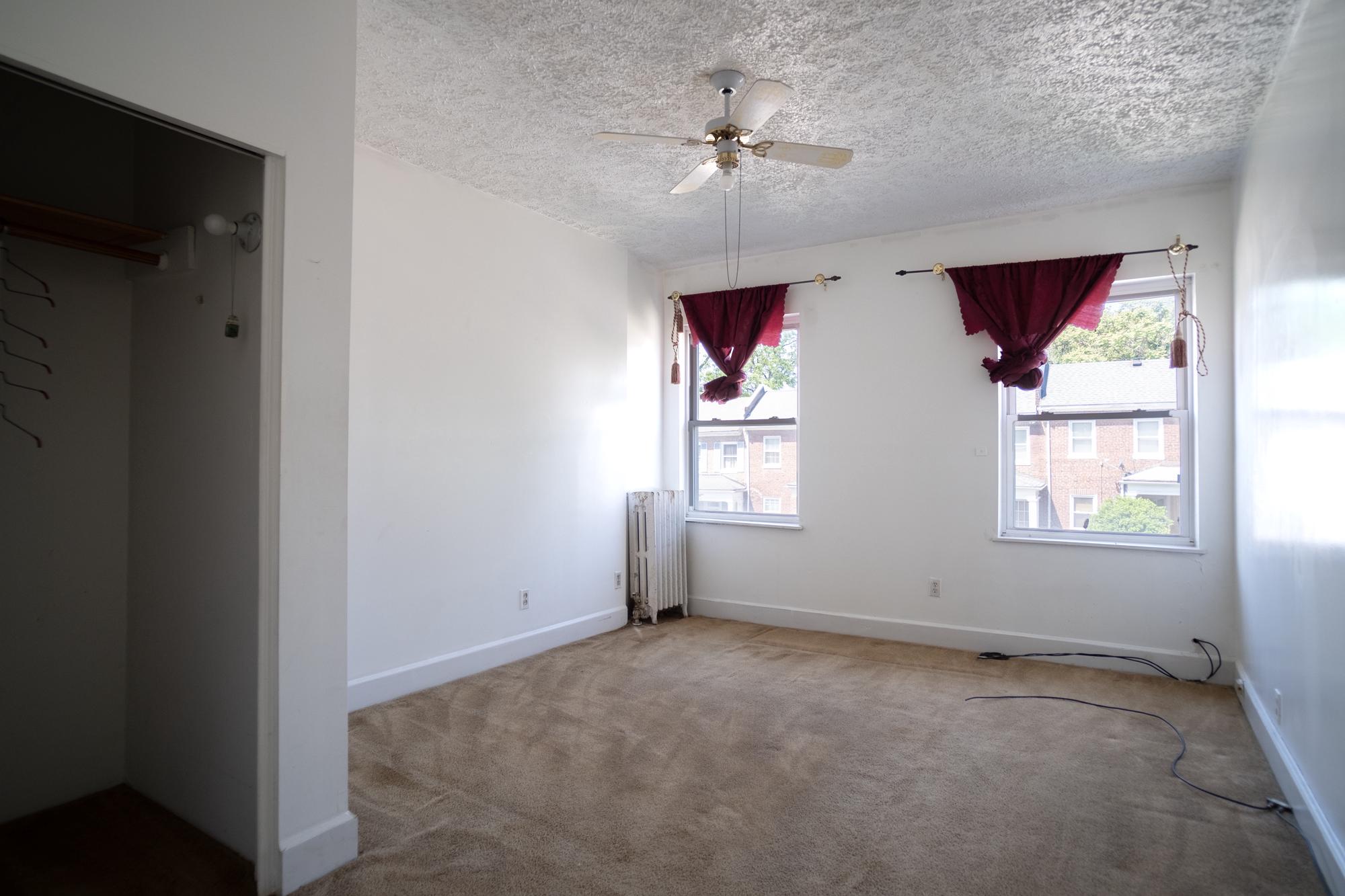 413 Rosecroft Terrace Baltimore, MD 21229 - Photo 12 of 21 an empty room with windows and fan