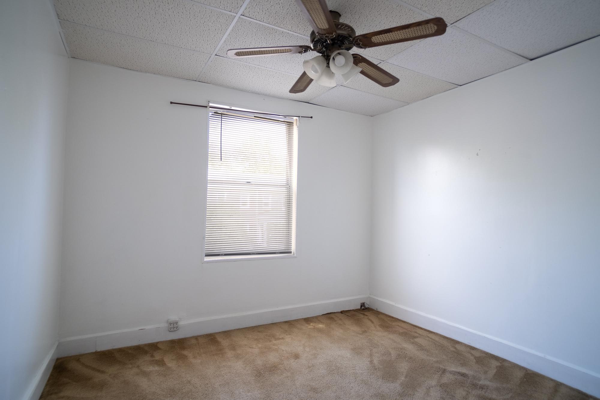 413 Rosecroft Terrace Baltimore, MD 21229 - Photo 13 of 21 an empty room with a window and a fan