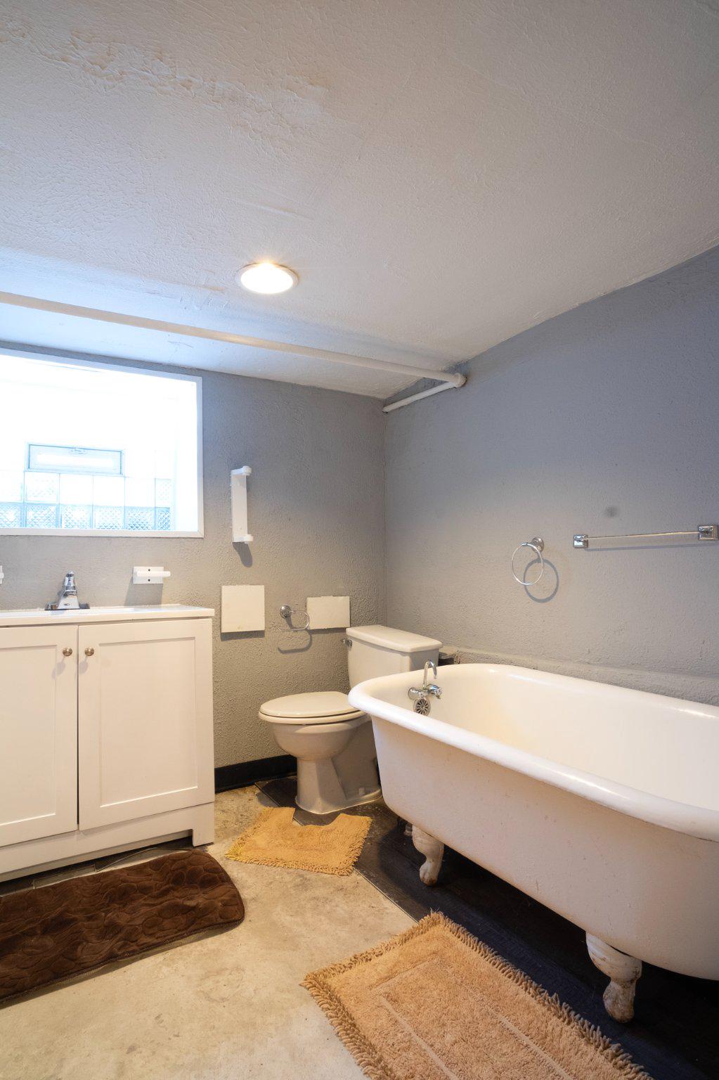 413 Rosecroft Terrace Baltimore, MD 21229 - Photo 18 of 21 a bathroom with a sink mirror and toilet