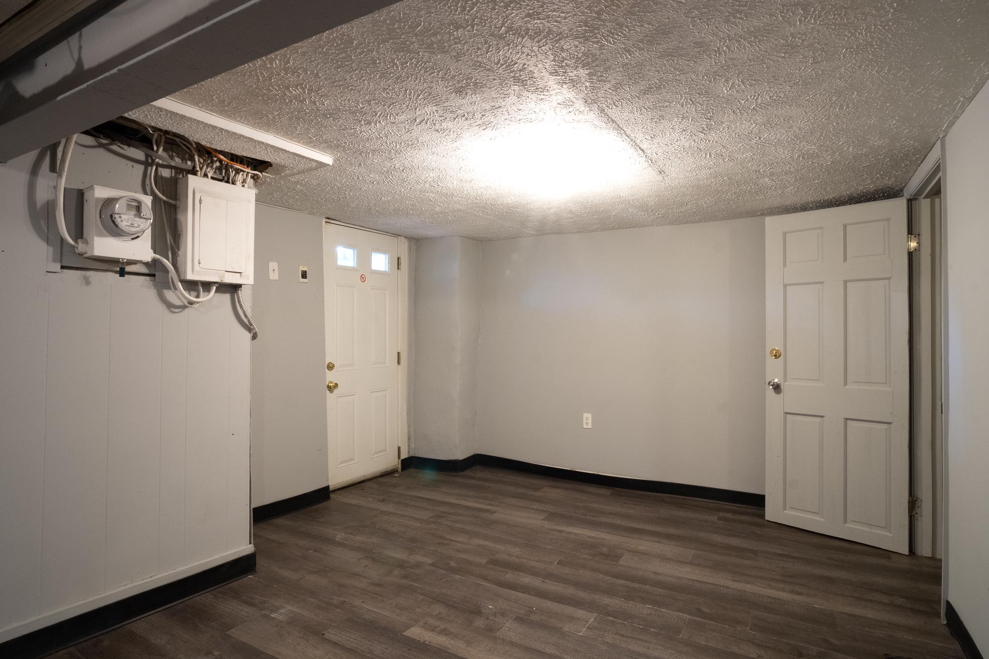 413 Rosecroft Terrace Baltimore, MD 21229 - Photo 20 of 21 a view of empty room with wooden floor