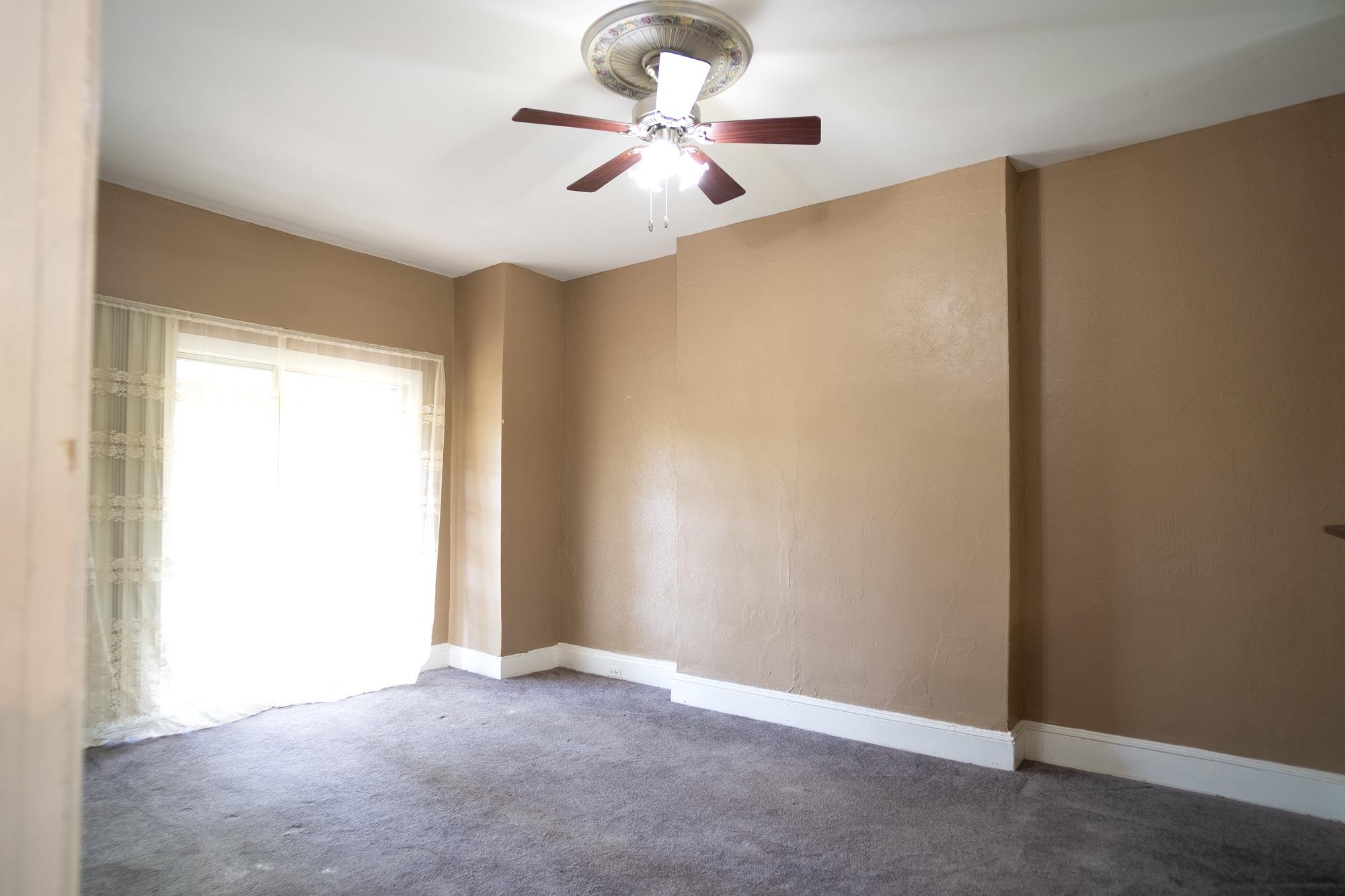 413 Rosecroft Terrace Baltimore, MD 21229 - Photo 6 of 21 an empty room with closet and a ceiling fan
