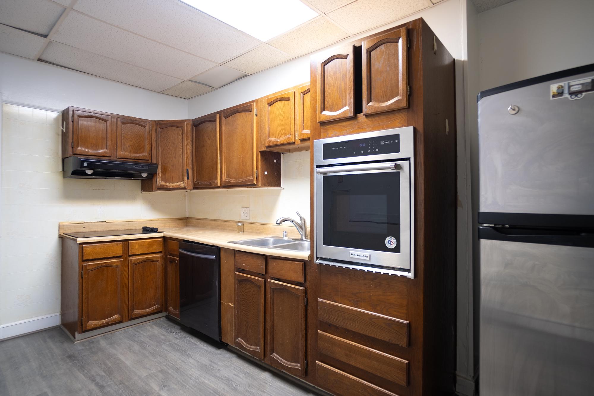 413 Rosecroft Terrace Baltimore, MD 21229 - Photo 8 of 21 a kitchen with stainless steel appliances granite countertop a refrigerator and a sink