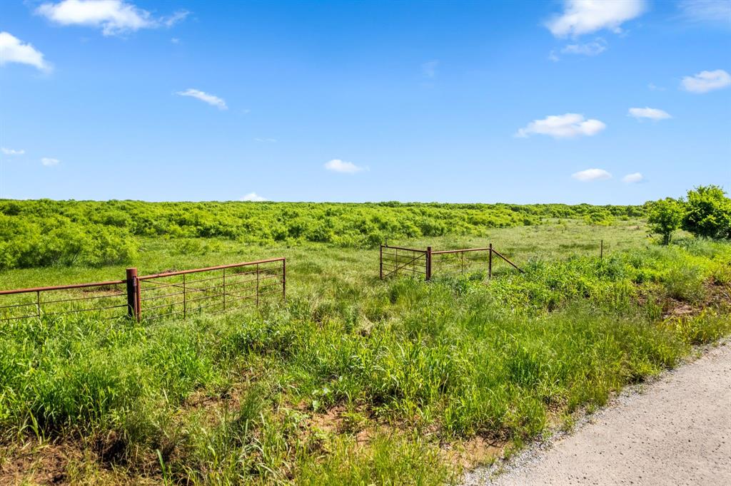 6213 Headquarters Road Iowa Park, TX 76367 - Photo 11 of 34 a view of a lake with a yard