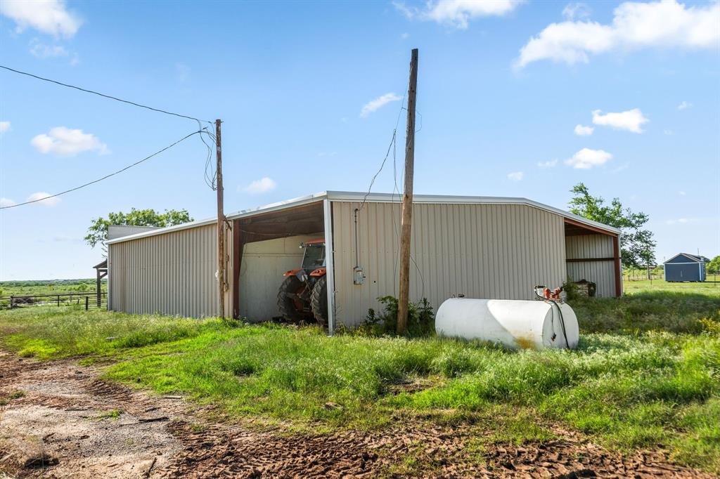 6213 Headquarters Road Iowa Park, TX 76367 - Photo 17 of 34 a backyard of a house with a table and chairs