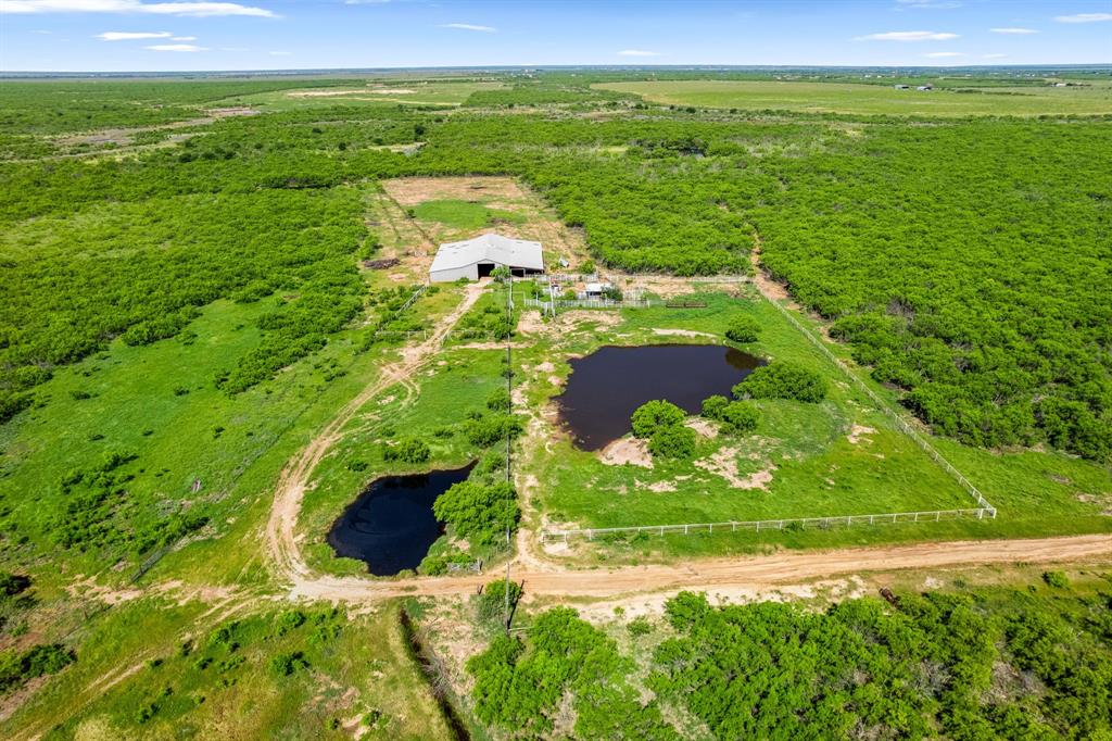6213 Headquarters Road Iowa Park, TX 76367 - Photo 20 of 34 a view of a lake with a big yard