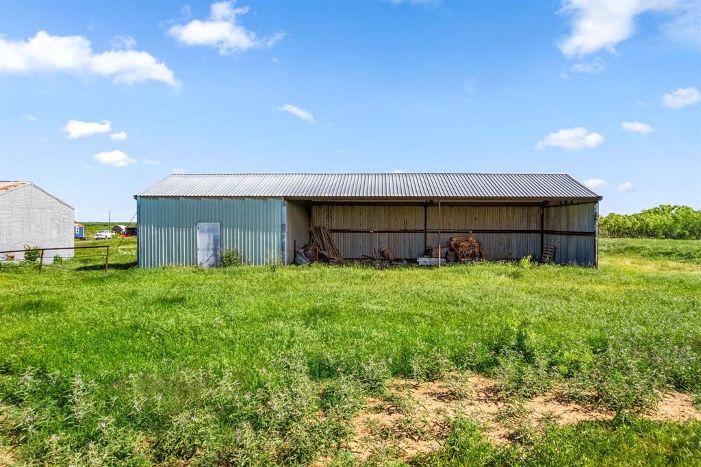 6213 Headquarters Road Iowa Park, TX 76367 - Photo 23 of 34 a view of a house with a yard and sitting area