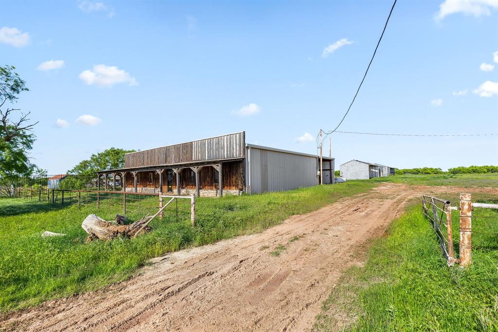 6213 Headquarters Road Iowa Park, TX 76367 - Photo 26 of 34 a front view of a house with garden
