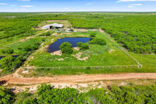 a view of a lake with a yard