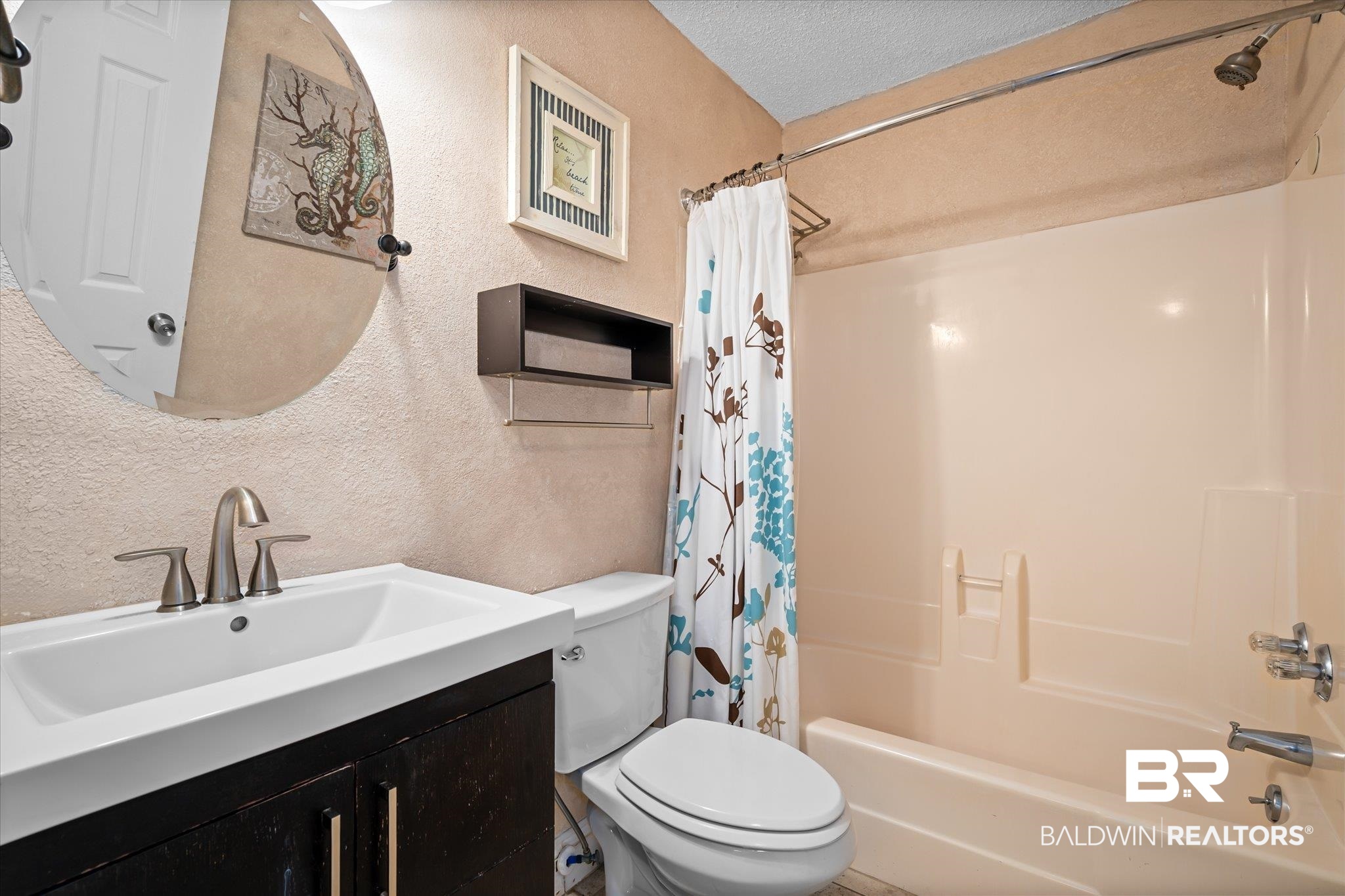 400 Plantation Road, Unit 3222 Gulf Shores, AL 36542 - Photo 13 of 31 Full bathroom with vanity, toilet, a textured ceiling, and shower / bath combo