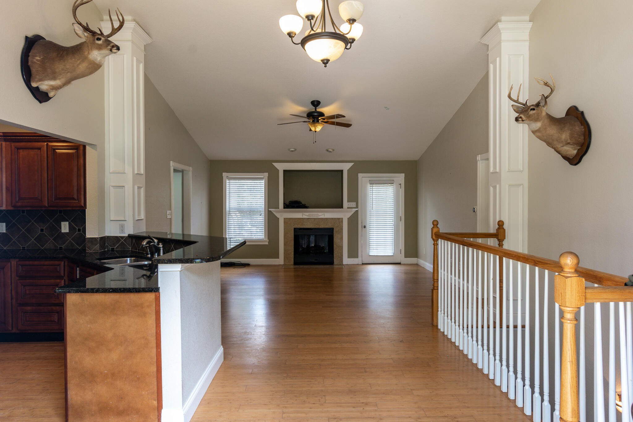 3328 Shagbark Road Powell, TN 37849 - Photo 3 of 32 a view of a livingroom with furniture a fireplace chandeliers fan