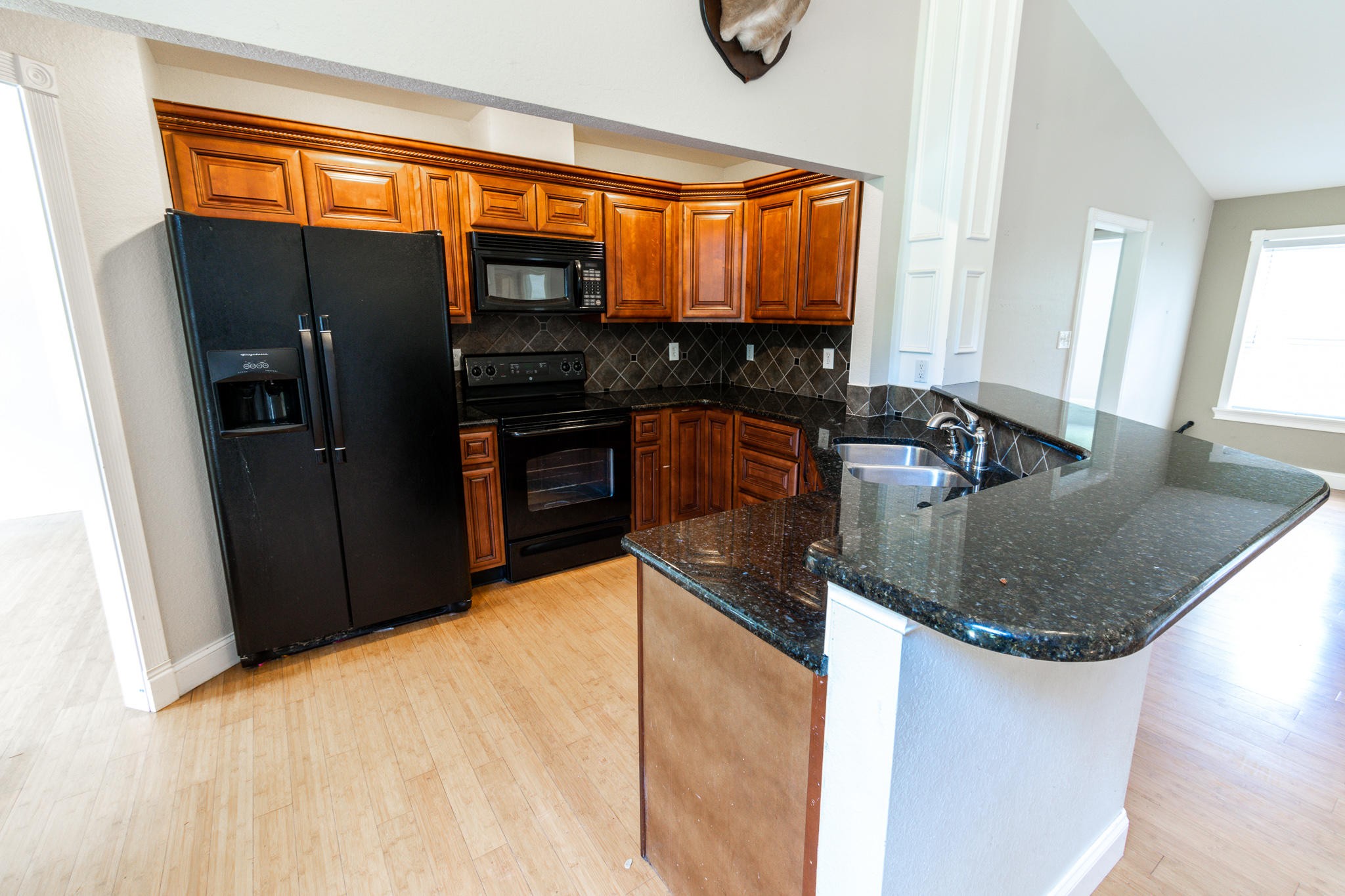 3328 Shagbark Road Powell, TN 37849 - Photo 4 of 32 a kitchen with stainless steel appliances granite countertop a sink a stove and a refrigerator