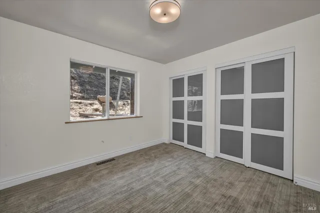 a view of a wooden deck with a trees
