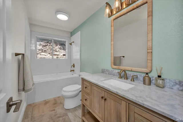 a view of a house with a yard and balcony