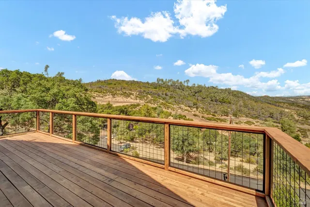 a view of a tree with yard