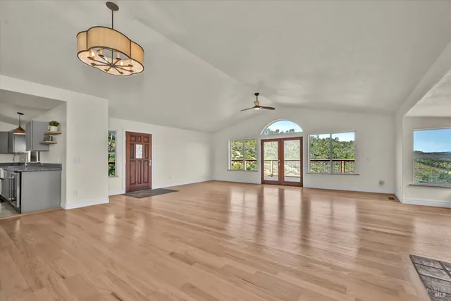 a kitchen with kitchen island a sink stainless steel appliances and cabinets