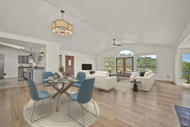 a kitchen with granite countertop cabinets stove top oven and microwave