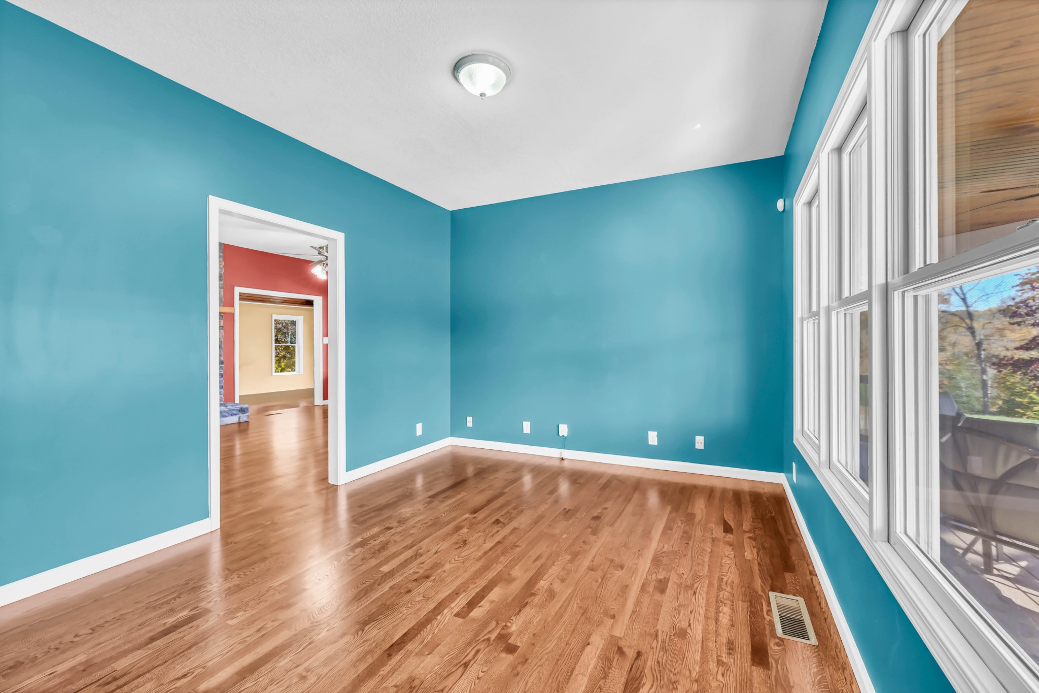 2753 Jarrell Ridge Road Clarksville, TN 37043 - Photo 22 of 80 a view of an empty room with wooden floor and a window
