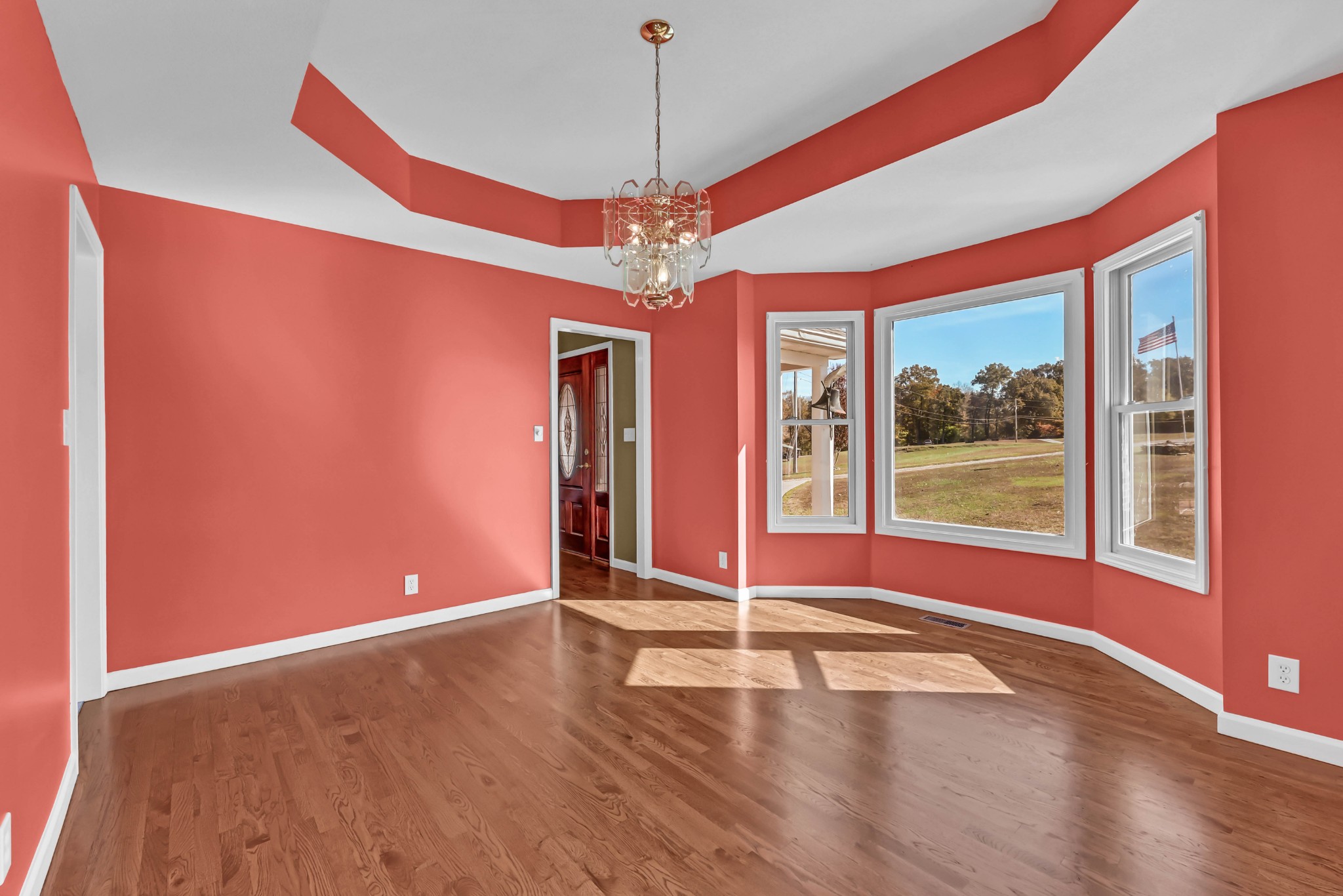 2753 Jarrell Ridge Road Clarksville, TN 37043 - Photo 25 of 80 a view of a livingroom with wooden floor a ceiling fan and windows