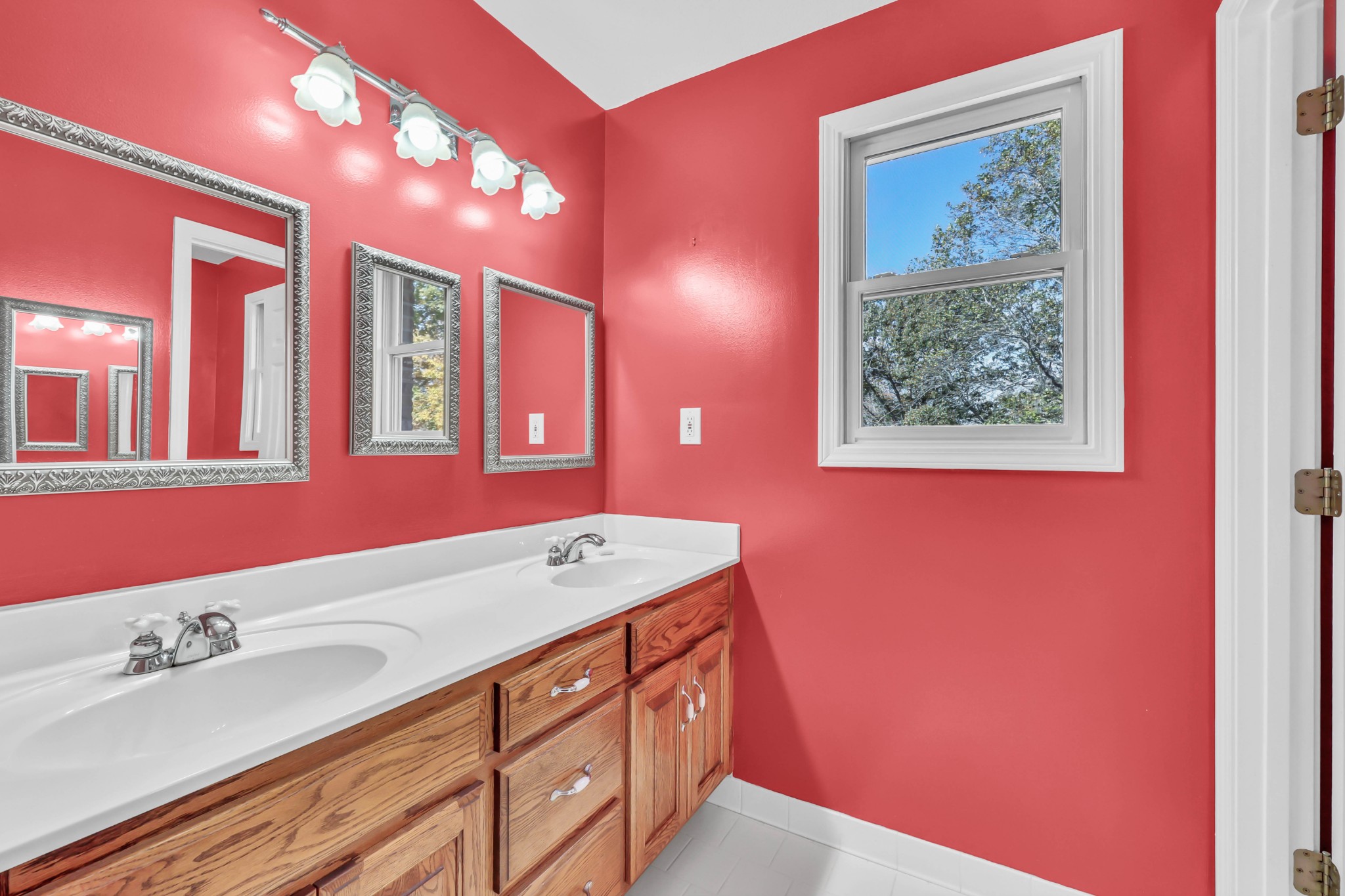 2753 Jarrell Ridge Road Clarksville, TN 37043 - Photo 32 of 80 a bathroom with a sink a vanity and a large mirror