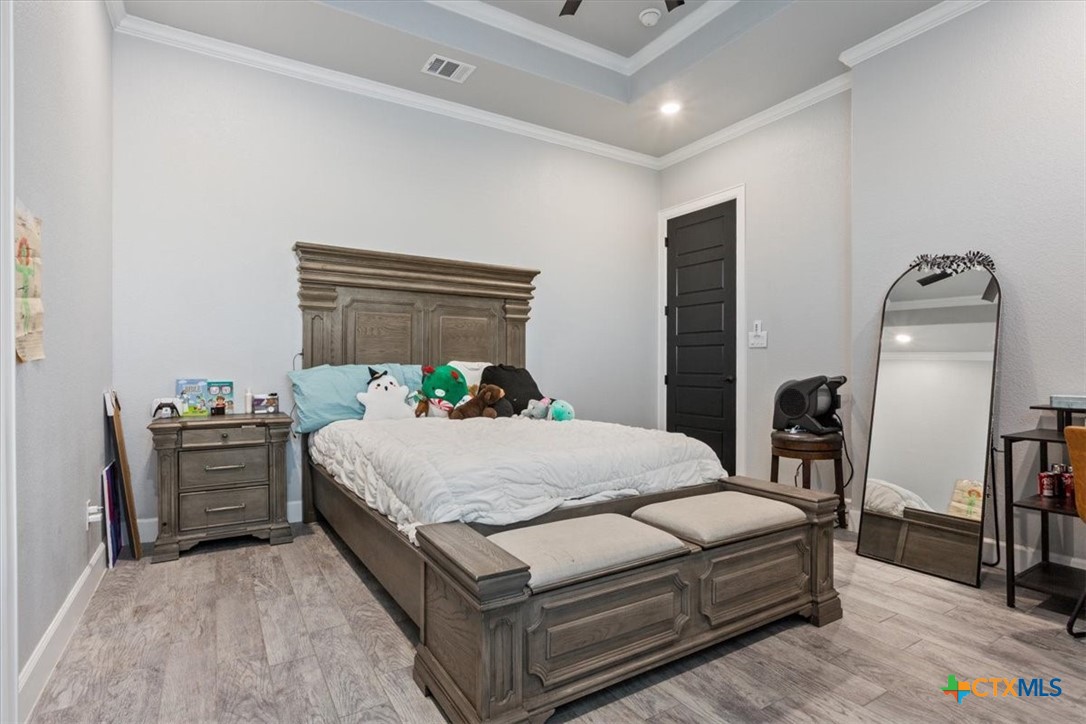 10940 Wedel Cemetery Road Rogers, TX 76569 - Photo 19 of 48 a bedroom with a bed table closet and a window