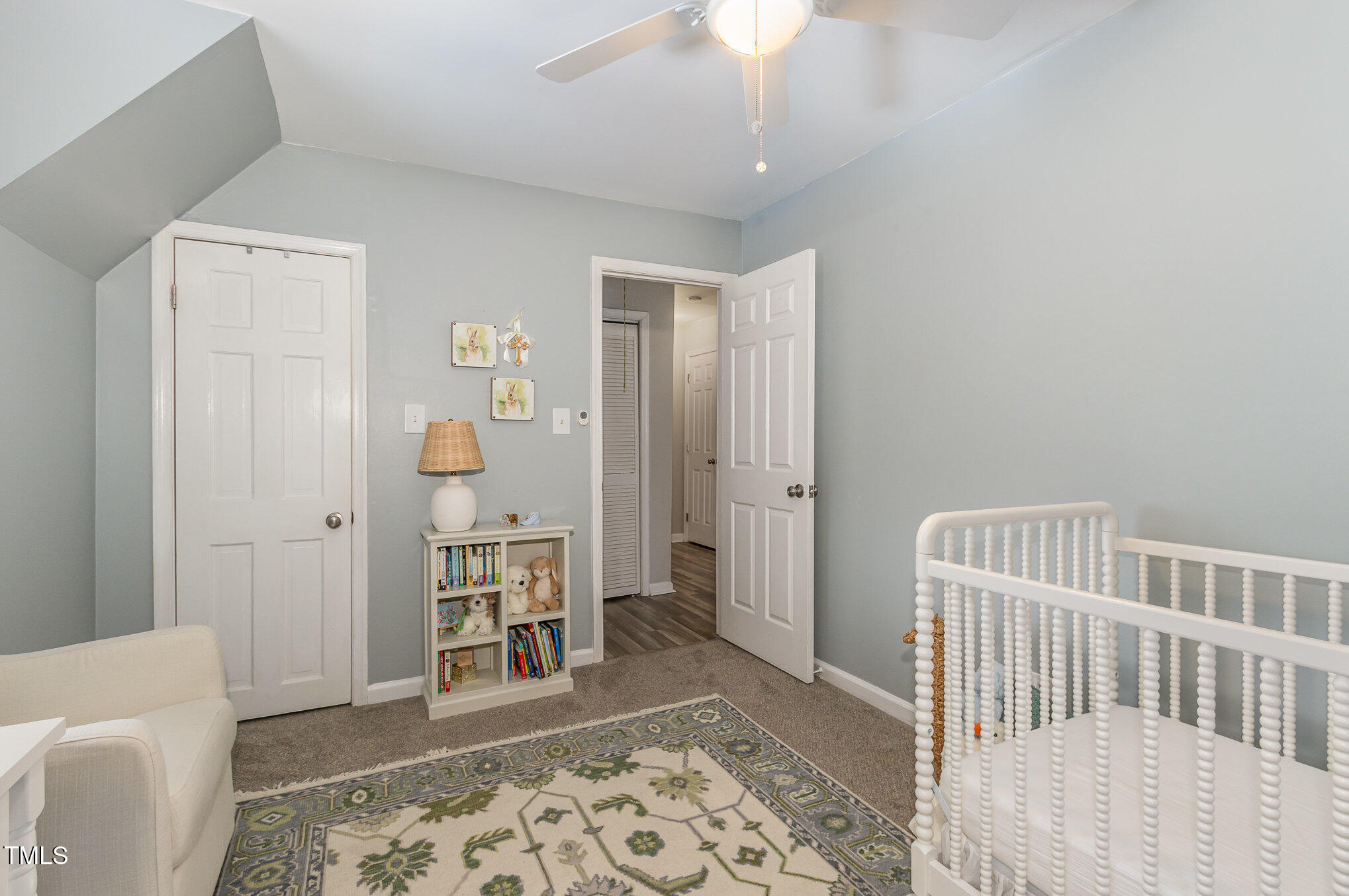 401 Rosehaven Drive Raleigh, NC 27609 - Photo 21 of 26 A walk-in closet completes this bedroom.