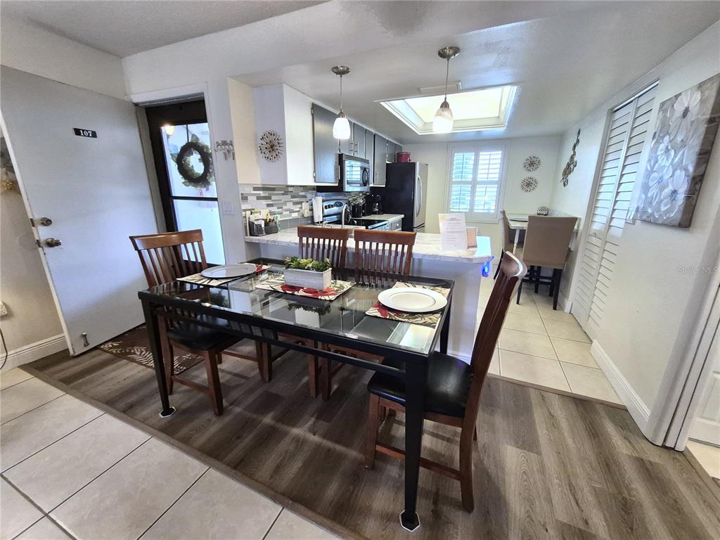 107 Windward Place, Unit 107 Oldsmar, FL 34677 - Photo 11 of 34 a view of a dining room with furniture