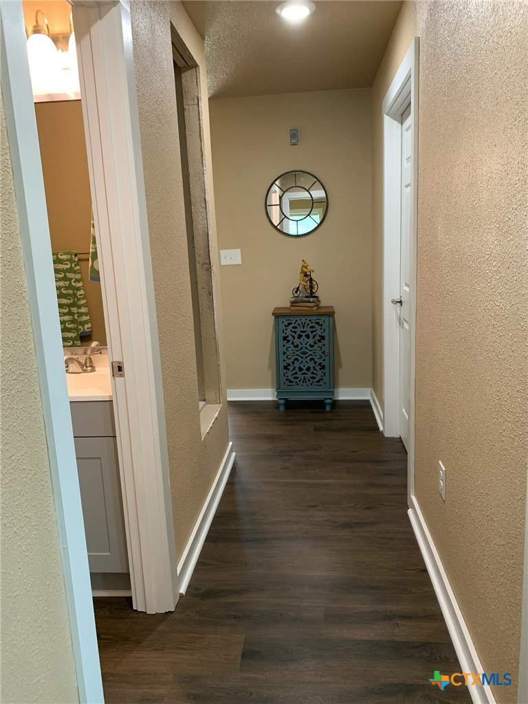 952 Fannin Loop Temple, TX 76501 - Photo 11 of 17 a view of a hallway with wooden floor