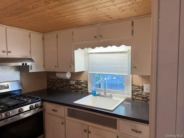 a view of hallway with wooden floor