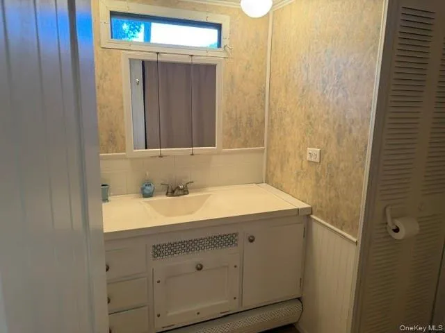 a bedroom with a bed and a chair