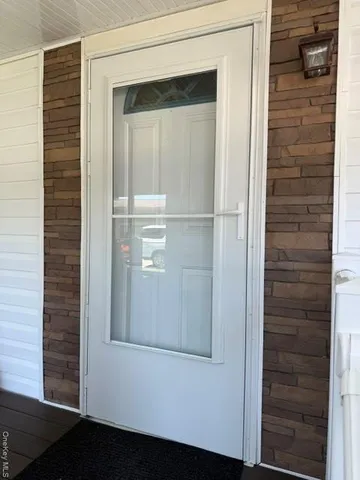 a backyard of a house with yard and outdoor seating
