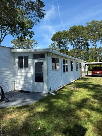 a view of a livingroom with furniture and wooden floor