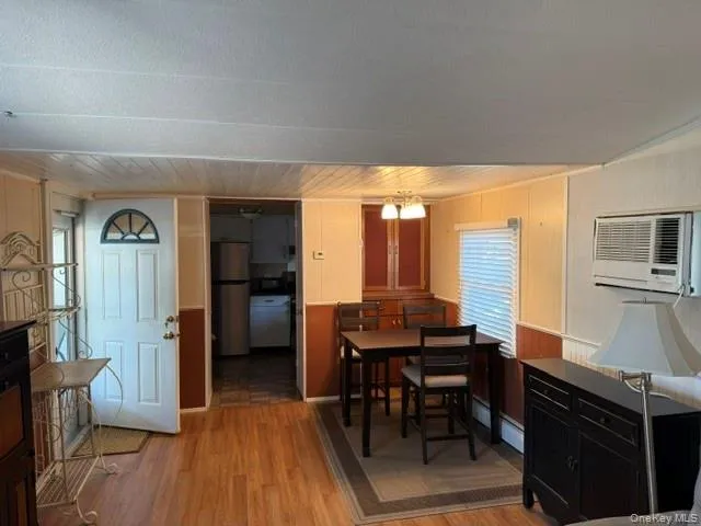 a kitchen with granite countertop a sink stainless steel appliances and cabinets