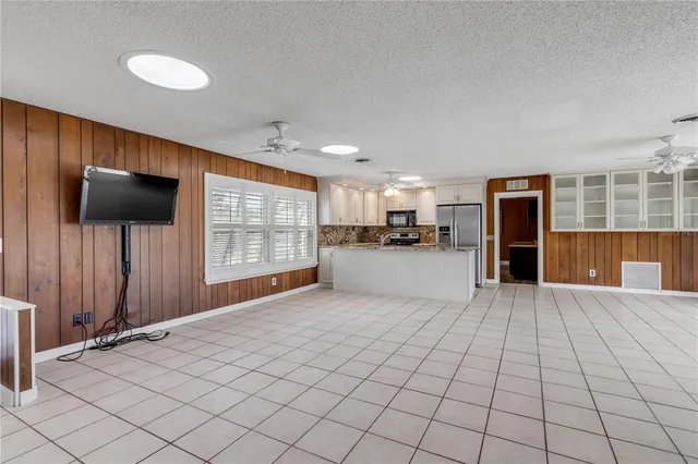 a kitchen with granite countertop a sink and a window