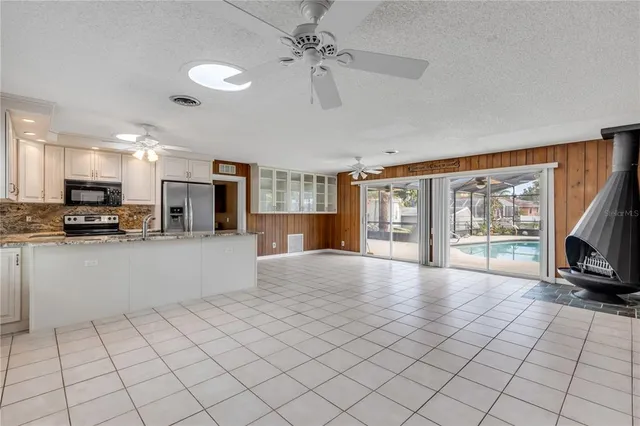 a view of a room with wooden floor and windows