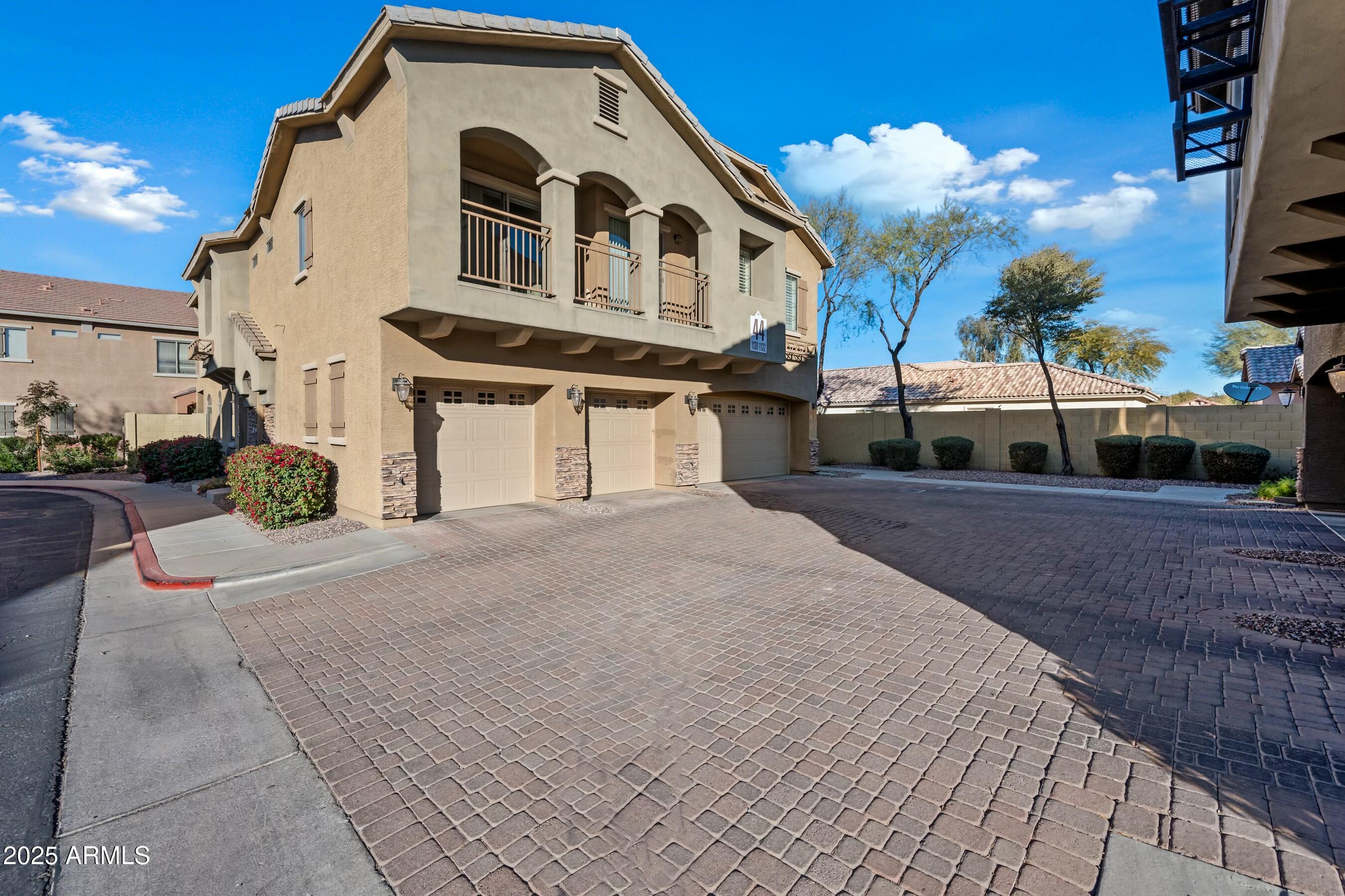 2150 East Bell Road, Unit 1130 Phoenix, AZ 85022 - Photo 1 of 39 a front view of a house with a yard
