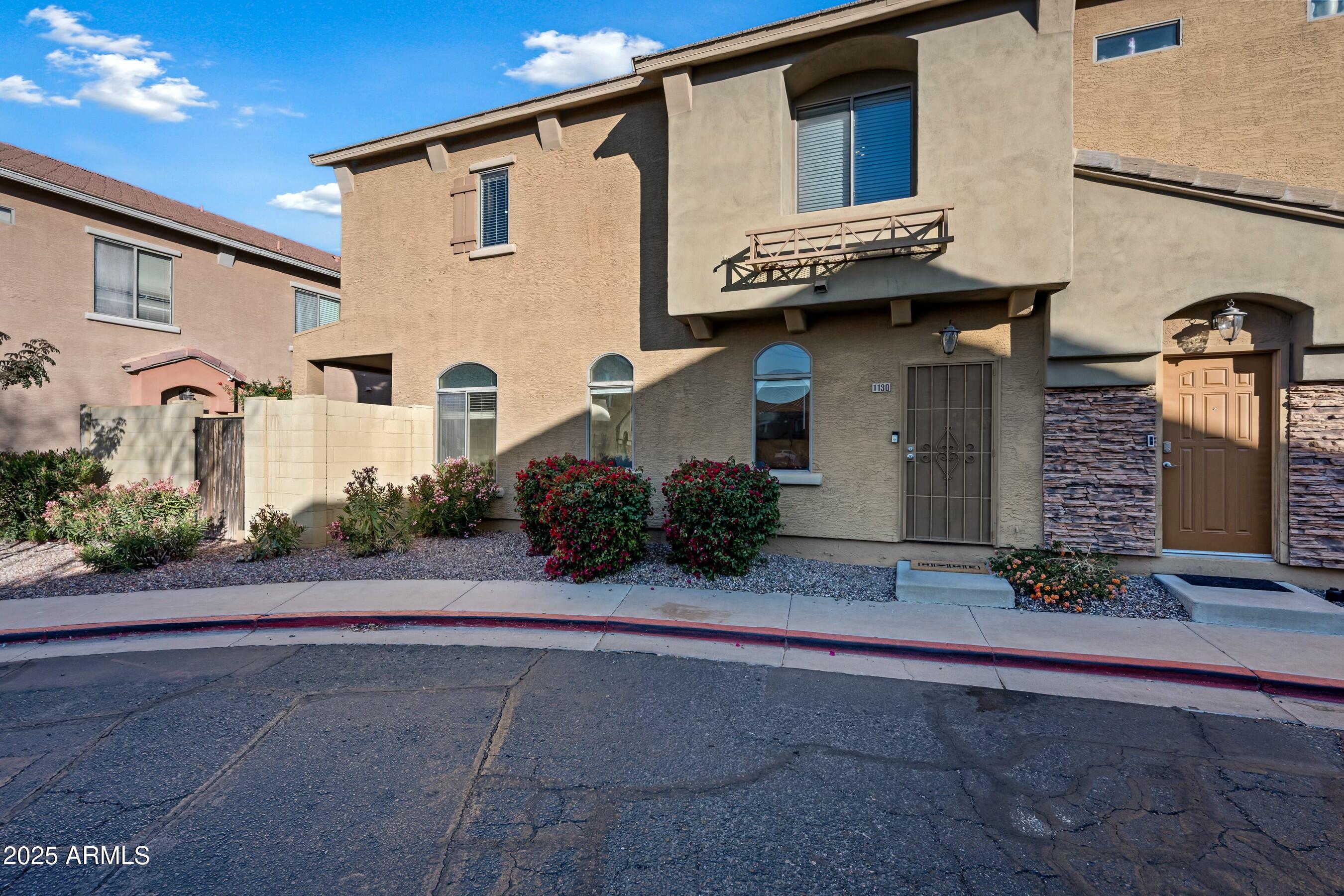 2150 East Bell Road, Unit 1130 Phoenix, AZ 85022 - Photo 2 of 39 a view of a house with a street