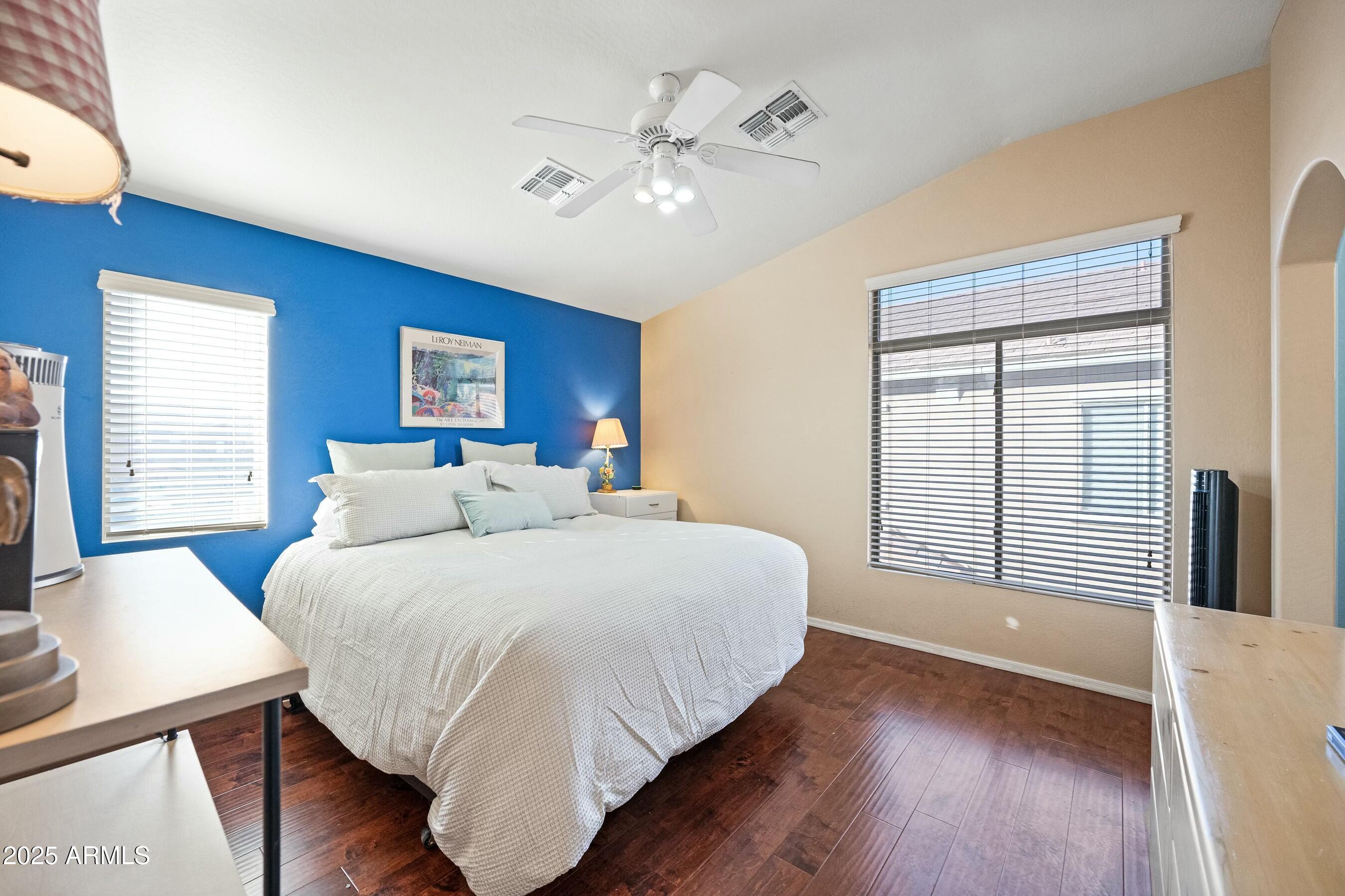 2150 East Bell Road, Unit 1130 Phoenix, AZ 85022 - Photo 20 of 39 a spacious bedroom with a large bed and a large window
