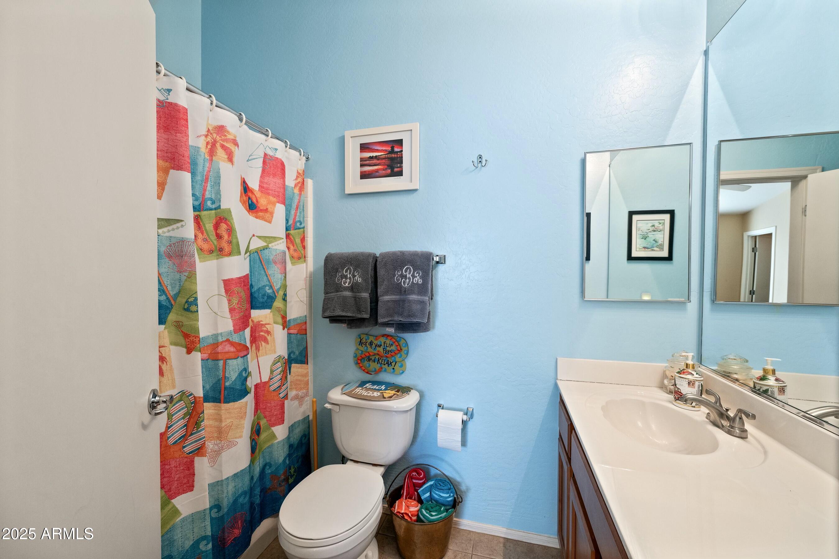 2150 East Bell Road, Unit 1130 Phoenix, AZ 85022 - Photo 28 of 39 a white toilet sitting next to a bathroom sink