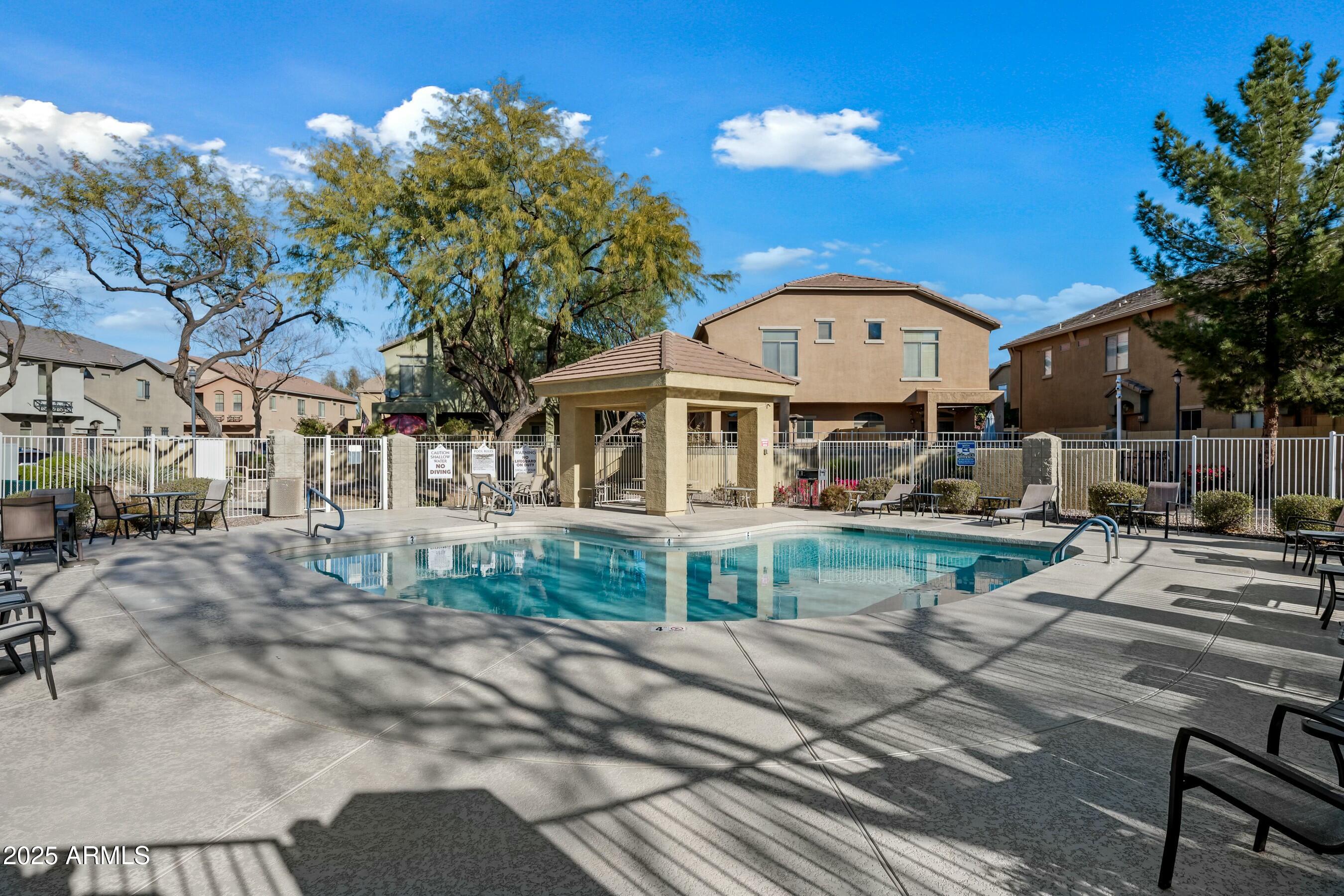 2150 East Bell Road, Unit 1130 Phoenix, AZ 85022 - Photo 30 of 39 a view of a house with a yard