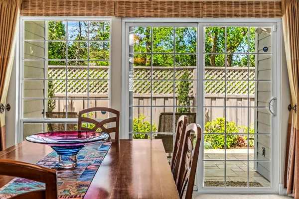 a view of a chairs and table in the patio