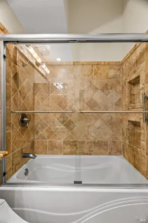 a bathroom with a shower and a bathtub