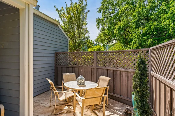 a view of a table and chairs in the patio