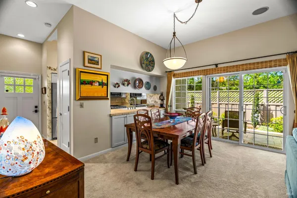 a view of a dining room with furniture window and outside view