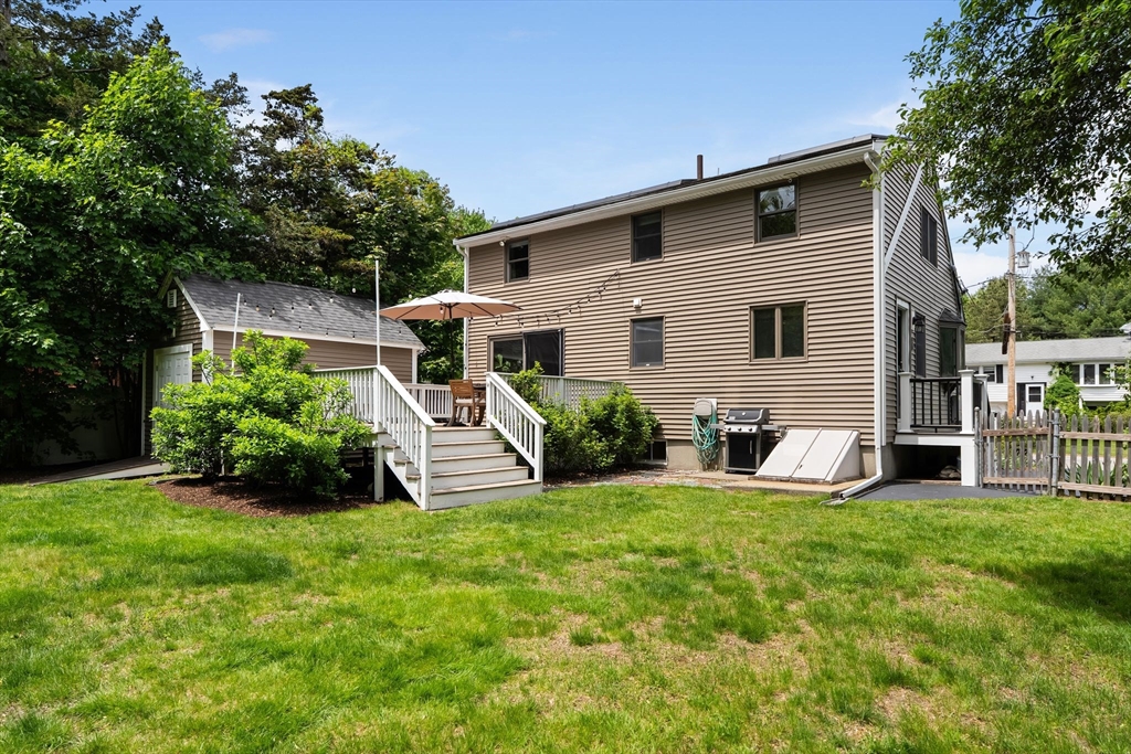 35 Spallus Road Stoughton, MA 02072 - Photo 39 of 39 a view of a house with a yard and sitting area