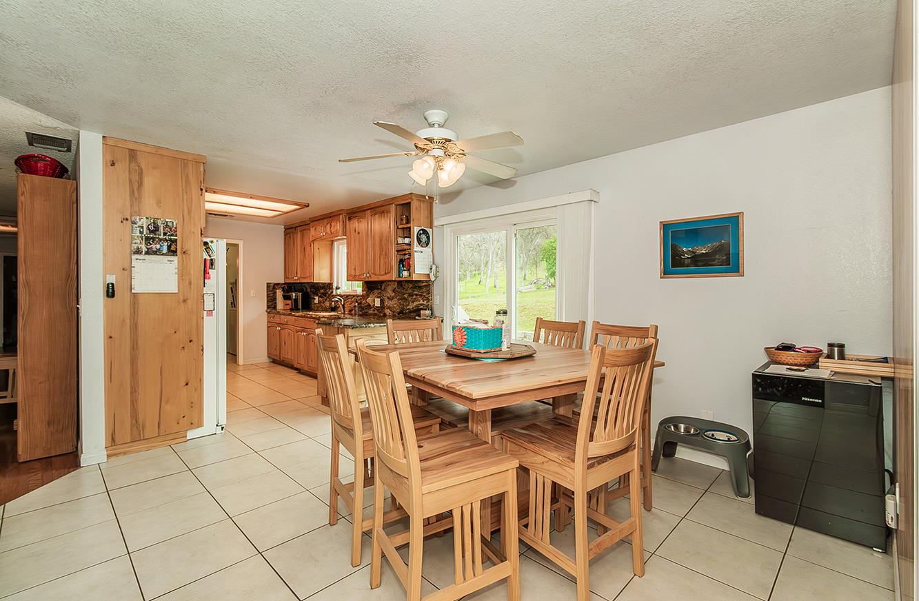 29979 Post Oak Road Tollhouse, CA 93667 - Photo 12 of 42 a view of a dining room with furniture and chandelier